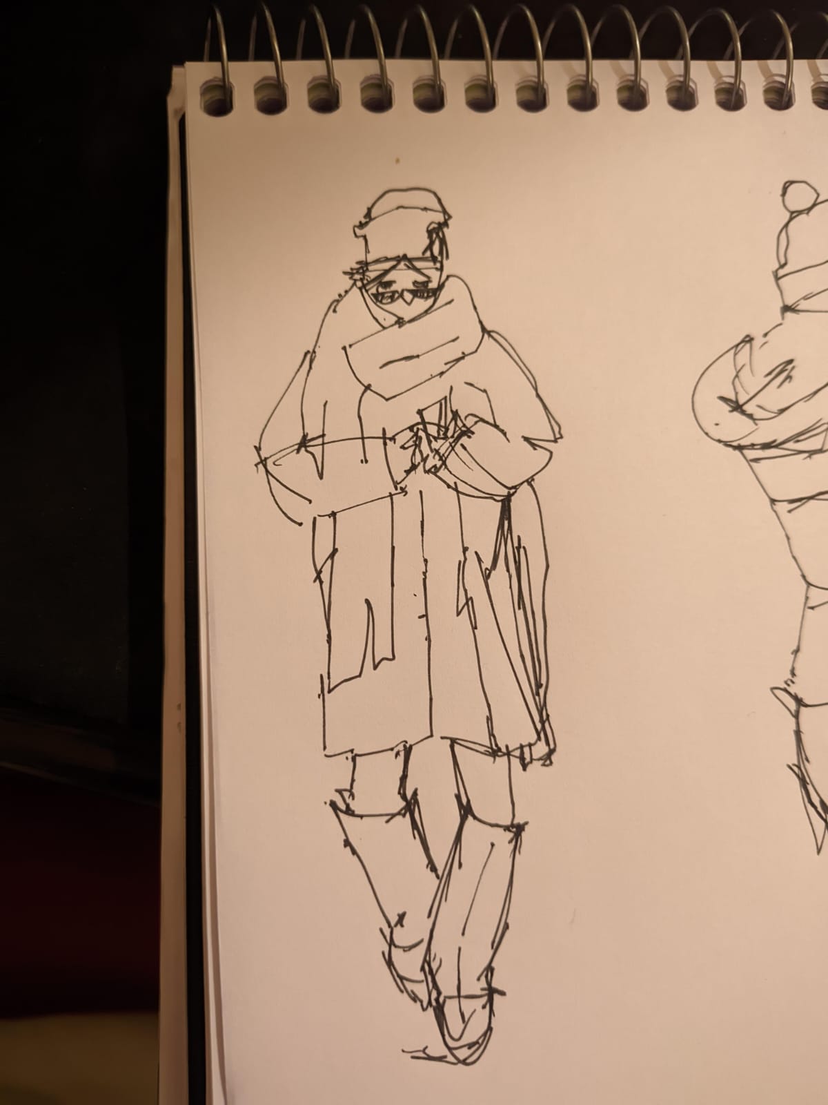 Impressionist line sketch of a figure in winter clothing