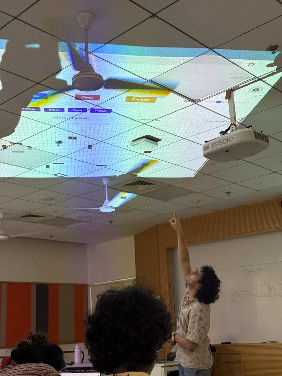 Ceiling projection of Game of Life simulation during a demonstration